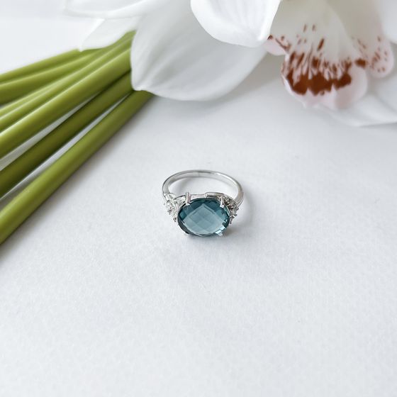 Silver ring with topaz London Blue