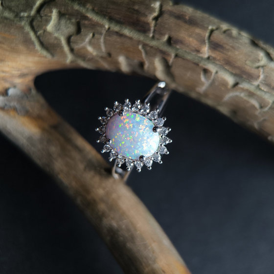 Silver ring with a 1.265-carat opal and cubic zirconia