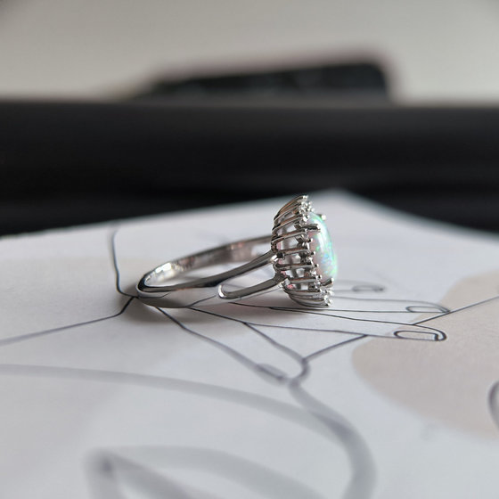 Silver ring with a 1.265-carat opal and cubic zirconia