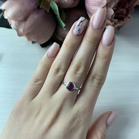 Silver ring with a ruby