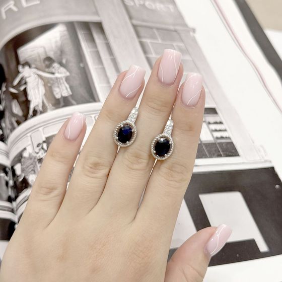 Sterling silver earrings with 4.927ct sapphire, pave diamonds