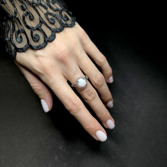 Silver ring with a 1.265-carat opal and cubic zirconia