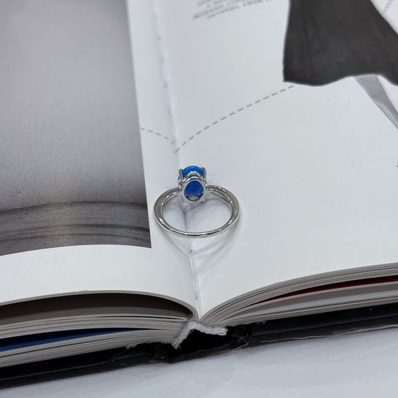Silver ring with a 0.975-carat opal and cubic zirconia
