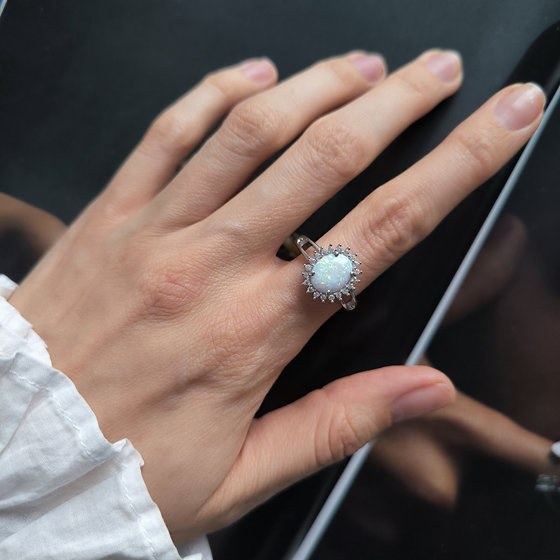Silver ring with a 1.265-carat opal and cubic zirconia
