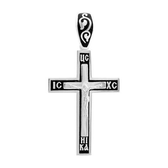 A silver cross with a jewel