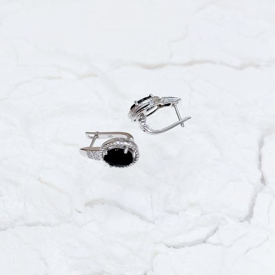 Sterling silver earrings with 4.927ct sapphire, pave diamonds