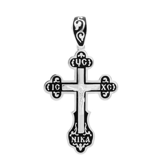 A silver cross with a jewel