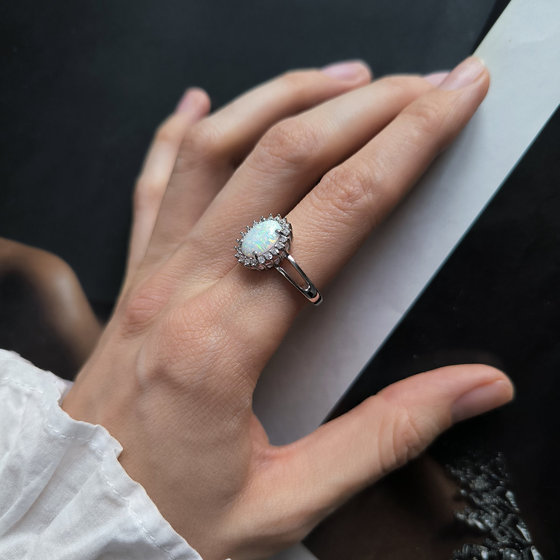 Silver ring with a 1.265-carat opal and cubic zirconia