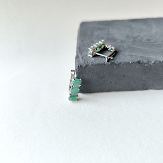 Silver earrings with a 2.006-carat emerald and cubic zirconia